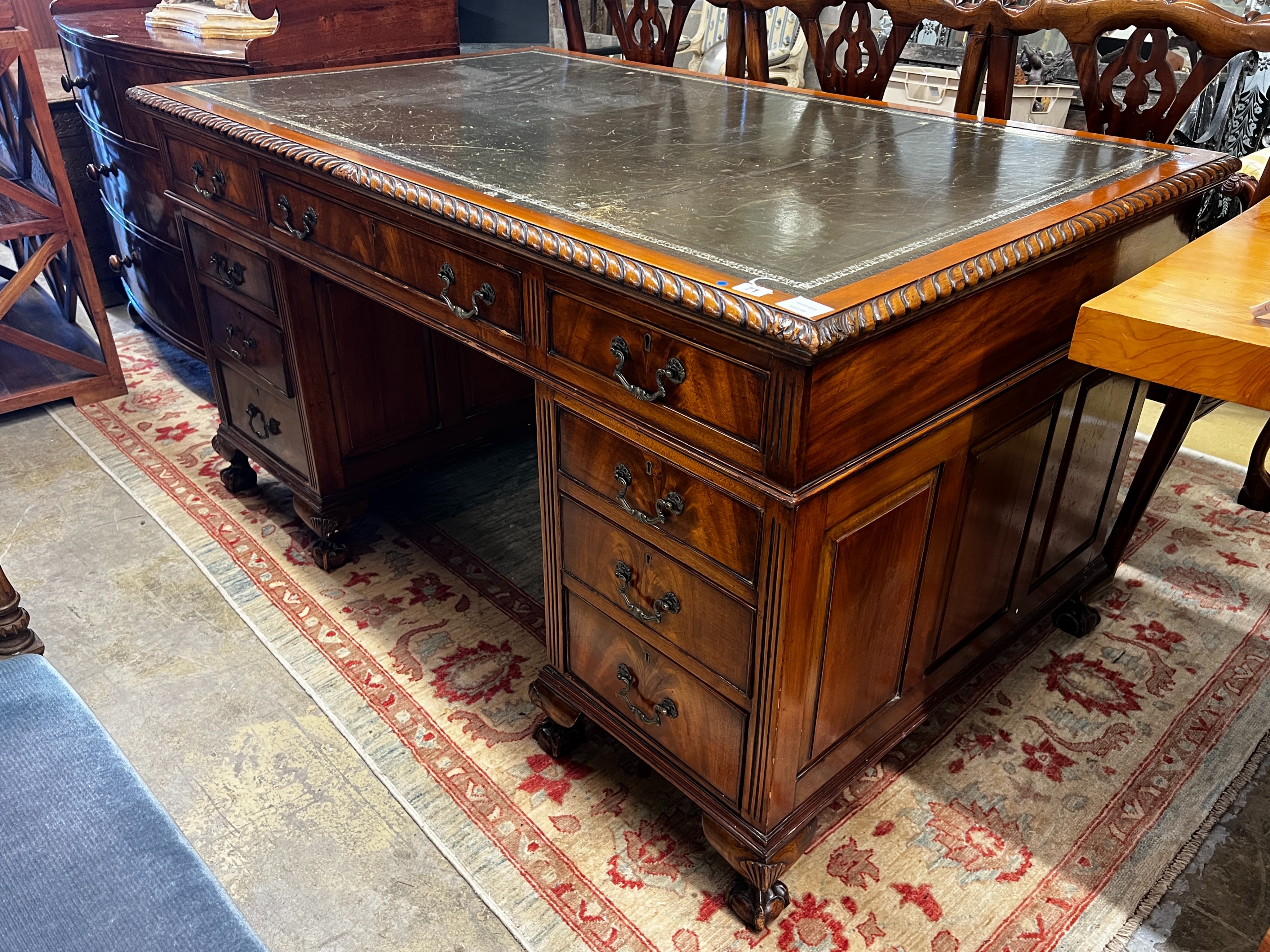 An early 20th century George III style mahogany pedestal desk, length 152cm, depth 91cm, height 81cm
